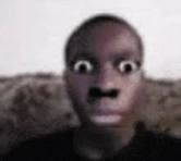 A person with their eyes opening wide