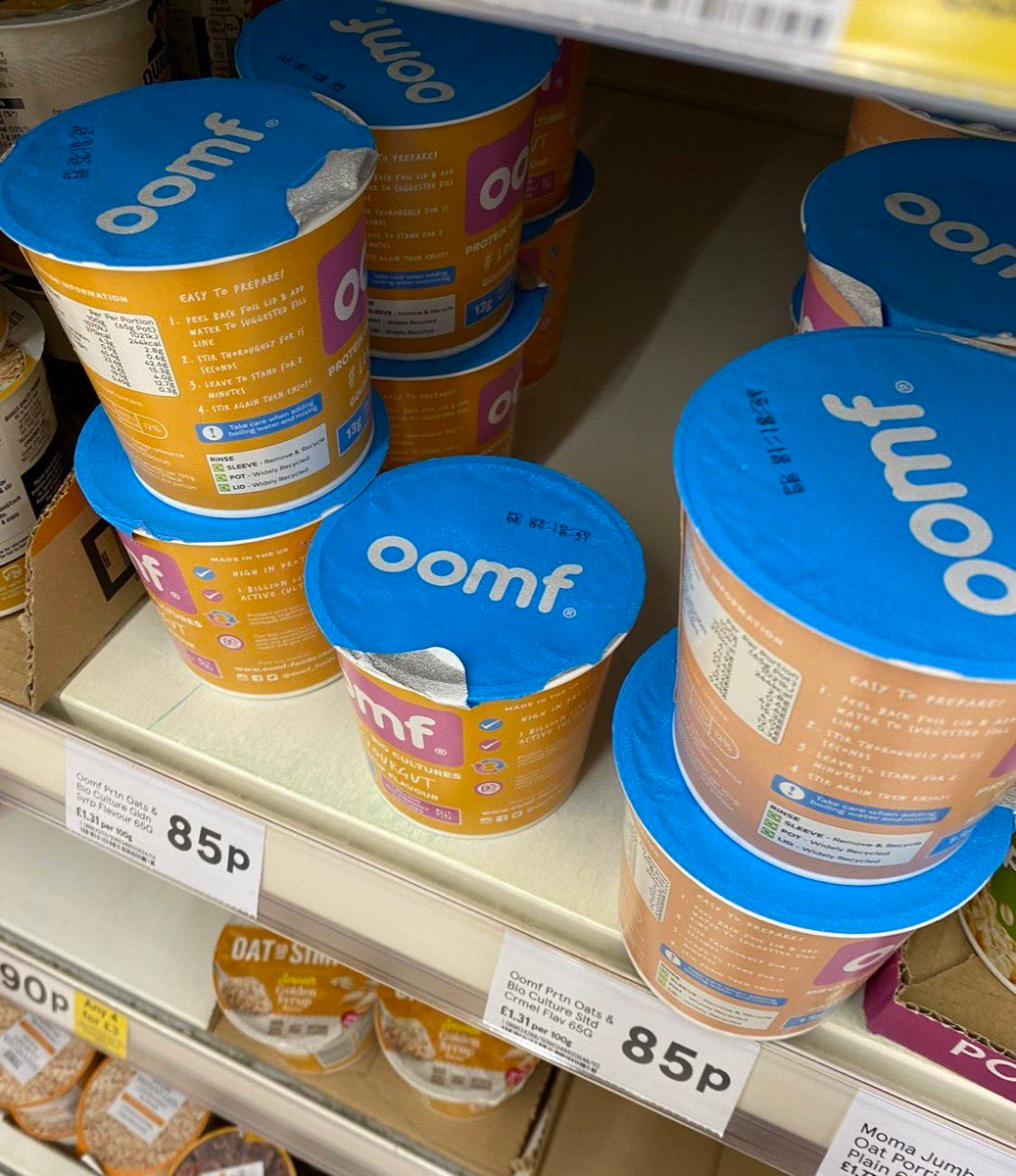 A picture of oomf. protein oats in a supermarket aisle